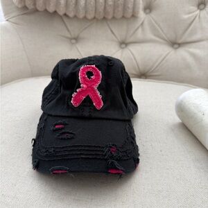 Woman’s black baseball cap- breast cancer